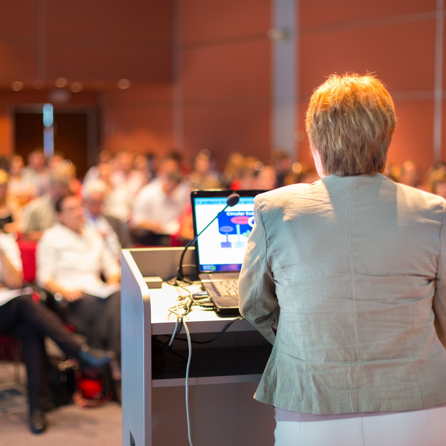 Business Woman Lecturing at Conference